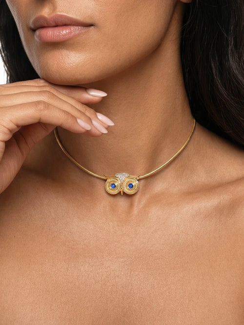 Athena Necklace in 14k yellow gold with blue sapphire eyes by SELIN KENT, worn on model